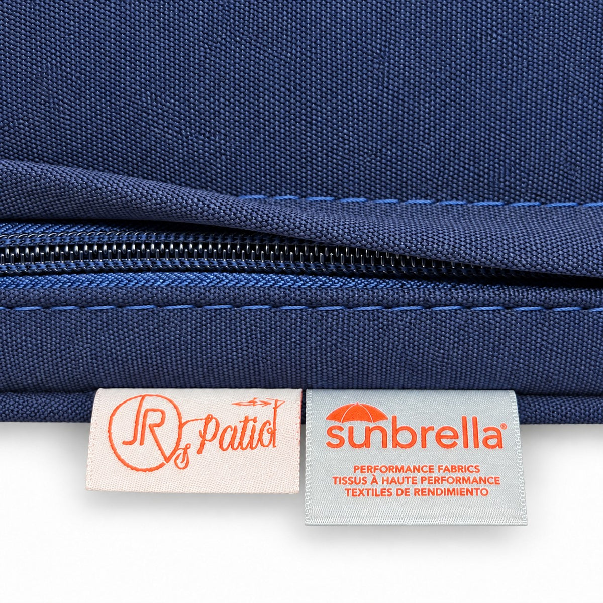 Mila Teak Swivel Club Chair – Sunbrella fabric tag and Jr's Patio label on the zippered cushion | Jr's Patio San Diego